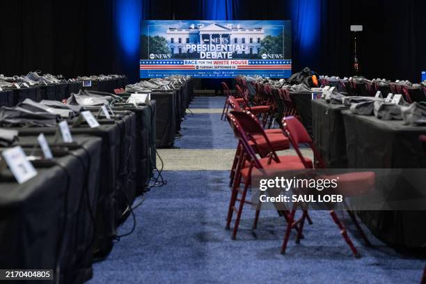 Workers complete preparations on the media filing center and spin room for the ABC News Presidential Debate between Democratic candidate Vice...