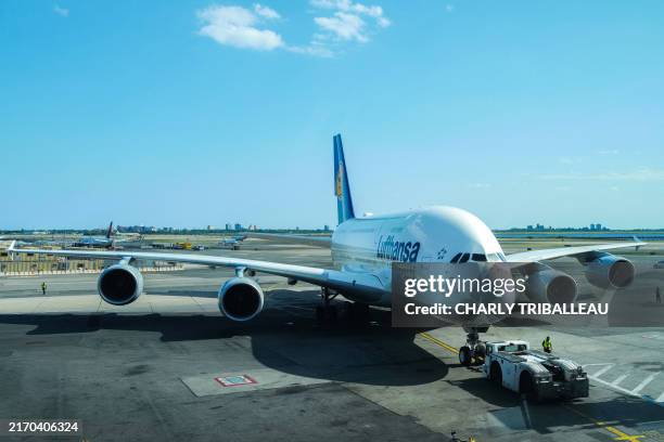 An Airbus A380-800 passenger aircraft of Lufthansa airline is seen arriving at terminal 1 of JFK International Airport in New York City, on September...