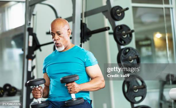 senior african-american man working out at gym - effort stock pictures, royalty-free photos & images