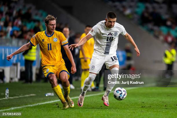 Zan Vipotnik of Slovenia fights for the ball during the UEFA Nations League 2024/25 League B Group B3 match between Slovenia and Kazakhstan at Arena...
