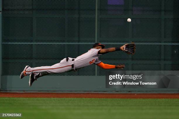 Cedric Mullins of the Baltimore Orioles makes a diving catch on a ball hit by Jarren Duran of the Boston Red Sox during the third inning at Fenway...