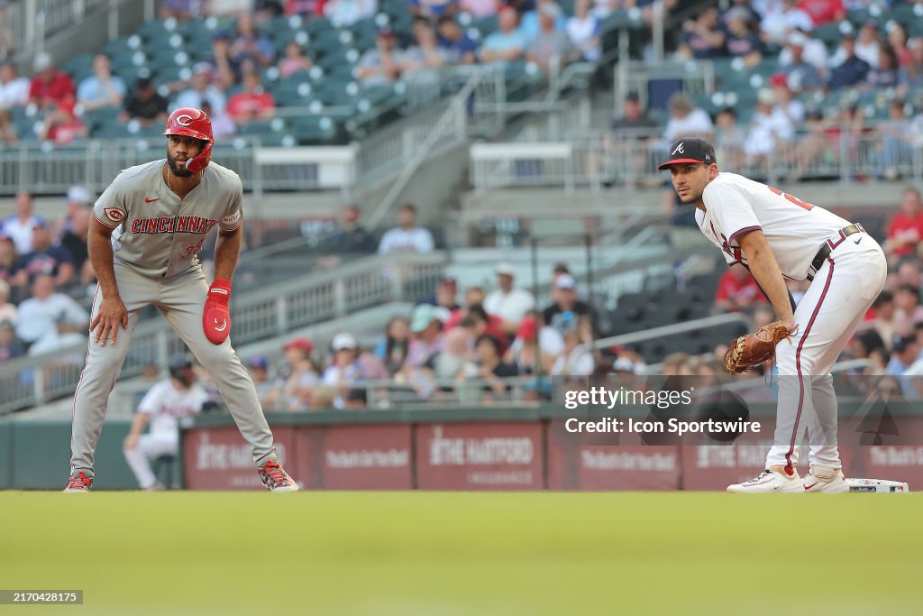 Brave Reds Racetrack Game Cincinnati Reds designated hitter Amed Rosario leads off first base ...