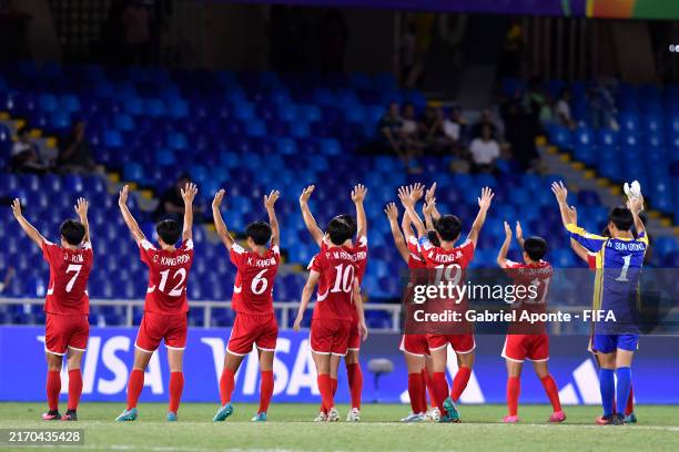 Jong Kum, Choe Kang Ryon, Kim Kang Mi, Pak Mi Ryong, Min Kyong Jin and Ham Ju Hyang of Korea DPR celebrate following the team's victory during the...