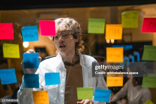 asian business person writing ai mind map with the tablet. - mind map stock pictures, royalty-free photos & images