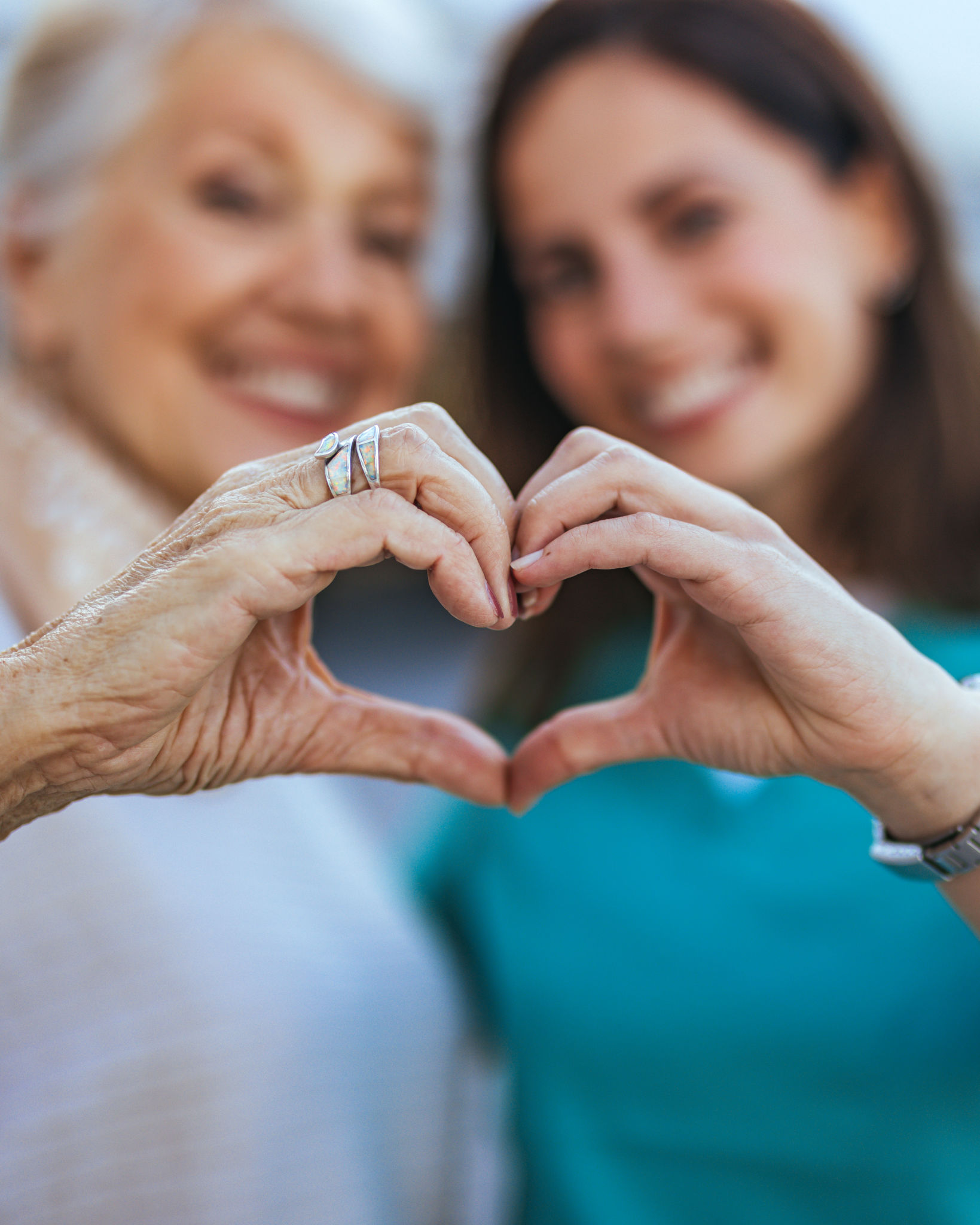 Elderly Woman and Young Woman Making Heart Gesture Elderly Woman and Young Woman Making Heart Gesture