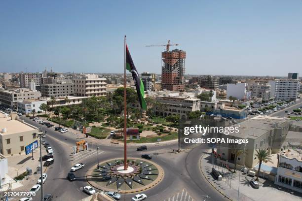 The flagpole seen in the center of Misrata, with ongoing construction of buildings.