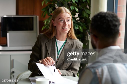 Housing officer assisting a tenant with forms Housing officer assisting a tenant with forms