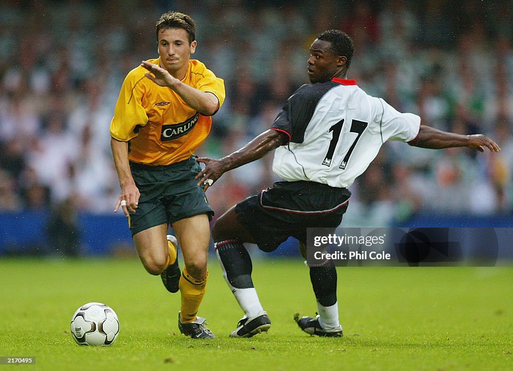 Liam Miller of Celtic gets away from Martin Djetou of Fulham