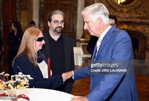 Beatrice Francq and King Philippe - Filip of Belgium pictured during a royal audience of the Be Heroes with the King, in Brussels, Tuesday 10...