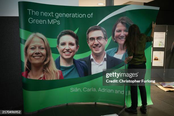 Poster depicting the four Green Party MPs is erected as delegates arrive for the Green Party Autumn Conference at Manchester Central on September 06,...