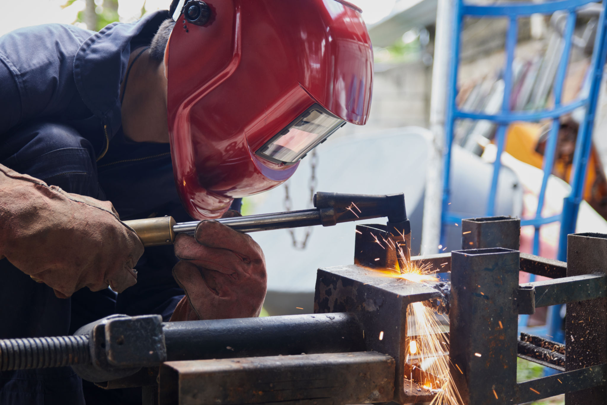 Welder or Welding Worker Holding Flaming Torch Cutting Metal or Iron Welder or Welding Worker Holding Flaming Torch Cutting Metal or Iron