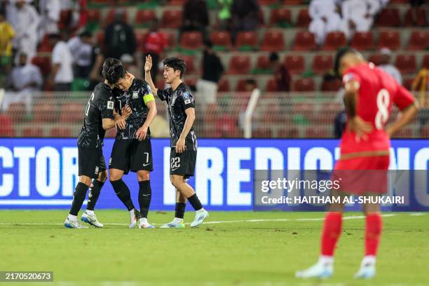 South Korea's players celebrate after winning the 2026 FIFA World Cup Asian qualification football match against South Korea at Sultan Qaboos Sports...