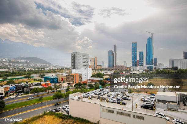 cityscape of the city of monterrey, mexico on a cloudy day - monterrey aerial stock pictures, royalty-free photos & images