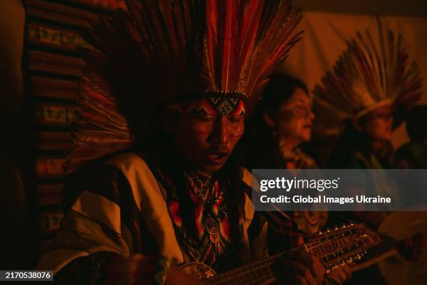 Shaman of "Pachamama" festival performs on traditional instruments during the ritual on August 5, 2024 in Zakarpattia Oblast, Ukraine. On August 1-14...
