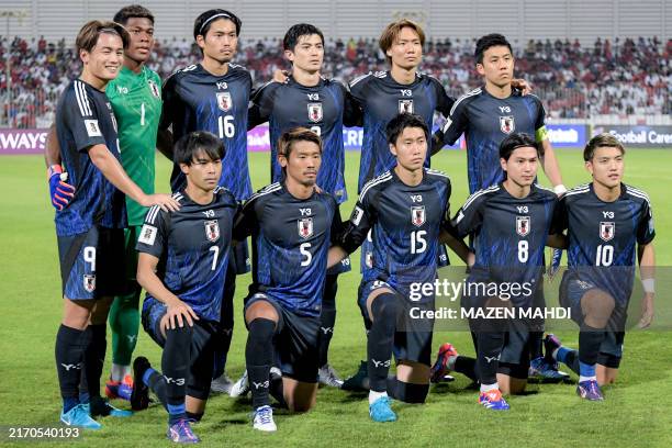 Japan's starting eleven pose for the group picture before the 2026 FIFA World Cup Asian qualification football match between Bahrain and Japan at...