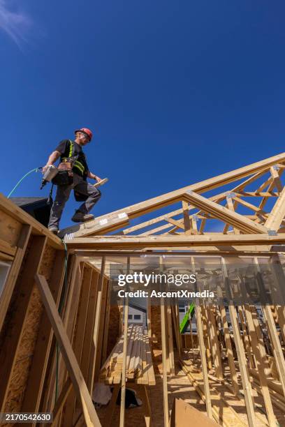 construction worker frames new home - try new things stock pictures, royalty-free photos & images