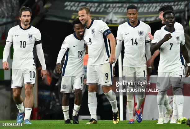 England's striker Harry Kane celebrates scoring the opening goal with England's midfielder Angel Gomes during their UEFA Nations League, League B -...