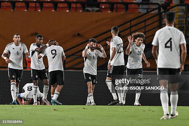 Libya's players celebrate after a goal during the CAF Africa Cup of Nations group D qualification match between Benin and Libya at the Felix...