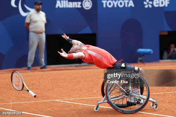 Alfie Hewitt of Team Great Britain celebrates winning a gold medal with team mate Gordon Reid of Team Great Britain against Takuya Miki of Team Japan...