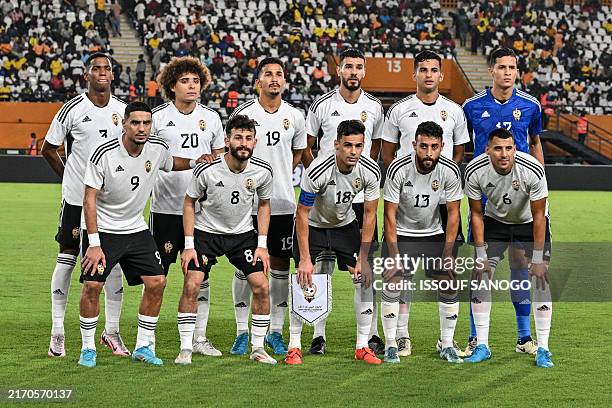 Libya's players pose for a team photograph ahead of the CAF Africa Cup of Nations group D qualification match between Benin and Libya at the Felix...