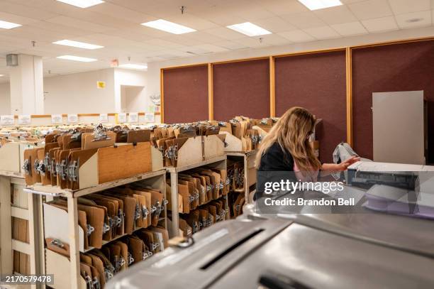 An employee sorts through documents at the IRS Processing Facility on September 06, 2024 in Austin, Texas. U.S. Secretary of the Treasury Janet...
