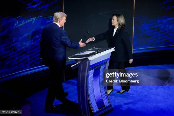 Vice President Kamala Harris, right, and former US President Donald Trump shake hands during the second presidential debate at the Pennsylvania...