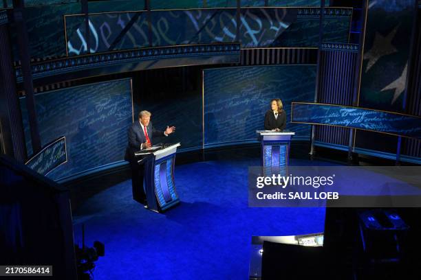 Vice President and Democratic presidential candidate Kamala Harris listens during a presidential debate with former US President and Republican...