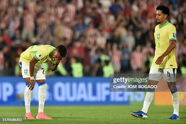Brazil's forward Estevao and Brazil's defender Marquinhos react after losing the 2026 FIFA World Cup South American qualifiers football match between...