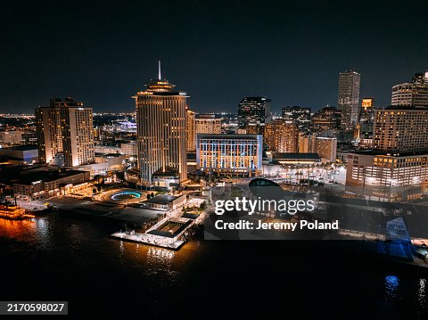 Illuminated Hotels and the New Orleans, Louisiana Skyline and Mississippi River at Night Illuminated Hotels and the New Orleans, Louisiana Skyline and Mississippi River at Night