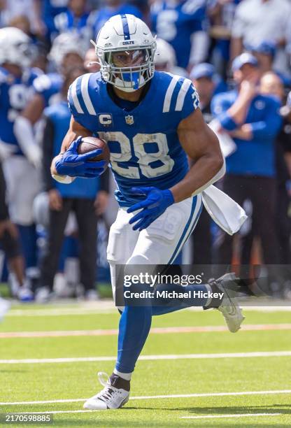 Jonathan Taylor of the Indianapolis Colts runs the ball during the game against the Houston Texans at Lucas Oil Stadium on September 8, 2024 in...