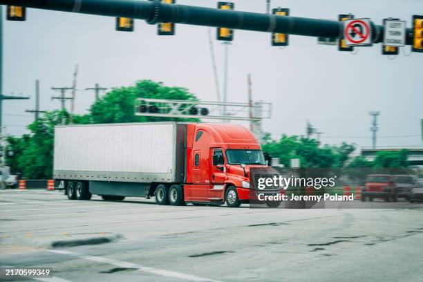 long exposure semi truck delivering goods in garland, texas in springtime - road intersection stock pictures, royalty-free photos & images