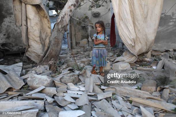 Palestinians inspect damage after Israeli airstrike hit a building in Nuseirat camp, Gaza on September 11, 2024. At least 4 Palestinians killed in...