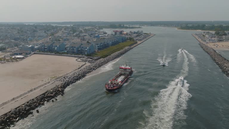https://media.gettyimages.com/id/2170616004/video/aerial-view-of-ships-entering-manasquan-inlet.jpg?b=1&s=640x640&k=20&c=9XZ7KNhQtXGq2vLELYnnZ_YNvvKGSSwONYr6yeFvMUw=