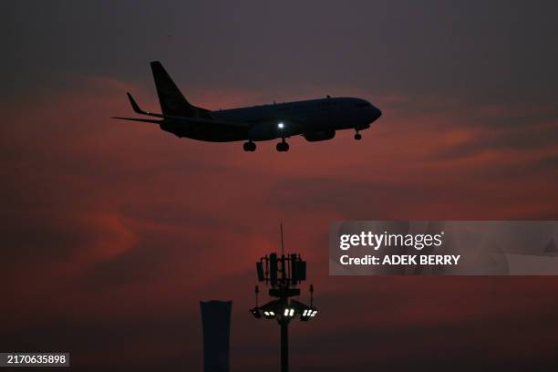 Hainan Airlines plane prepares to land at Beijing Capital International Airport in Beijing on September 11, 2024.