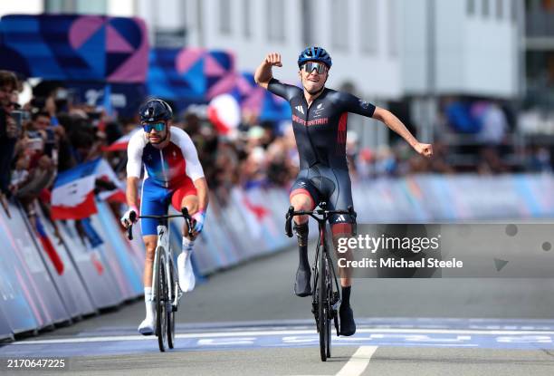 Gold medalist, Finlay Graham celebrates crossing the finish line to win during the Men's C1-3 Road Race on day ten of the Paris 2024 Summer...