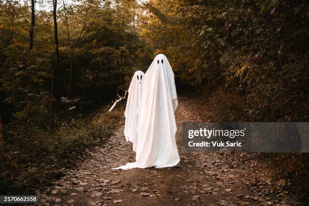 two ghosts on the road - dia das bruxas imagens e fotografias de stock