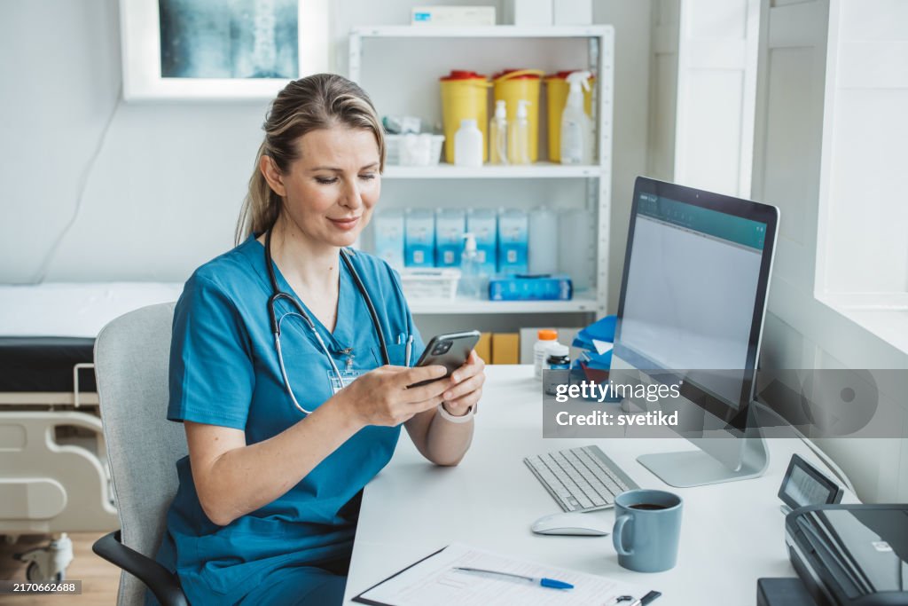 Female doctor sitting behind desk in office