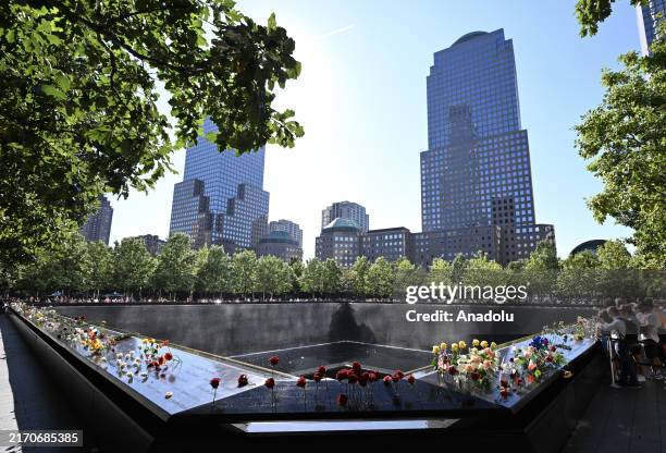 Relatives of victims of the 9/11 attacks visit the National September 11 Memorial and Museum to lay flowers in memory of the victims of the attacks...