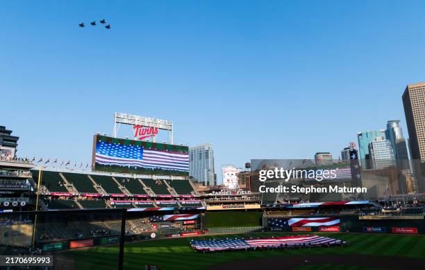 Members of the 421st Fighter Squadron perform a flyover during a pregame 9/11 remembrance ceremony before the game between the Los Angeles Angels and...