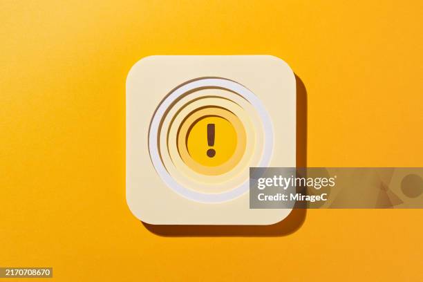 yellow exclamation point in concentric circles, paper craft - beat the clock stock pictures, royalty-free photos & images