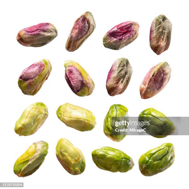 pistachios isolated on white background - levitation stock-fotos und bilder