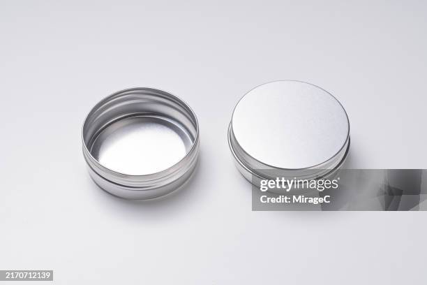 closed aluminum jar and opened aluminum jar on white - lid stock pictures, royalty-free photos & images