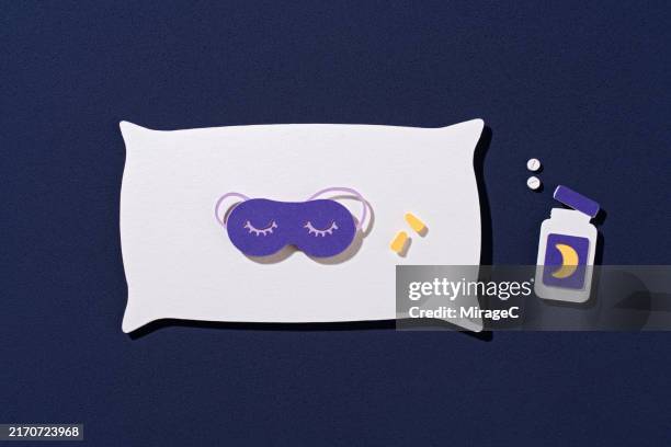 items to overcome insomnia beside the pillow, paper craft - melatonin isolated stock pictures, royalty-free photos & images