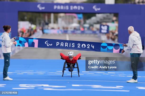 Catherine Debrunner of Team Switzerland crosses the finish line during the Women's Marathon T54 on day eleven of the Paris 2024 Summer Paralympic...