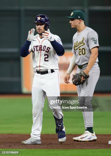 Houston Astros third baseman Alex Bregman hits a double in the bottom of the second inning during the MLB game between the Oakland Athletics and...