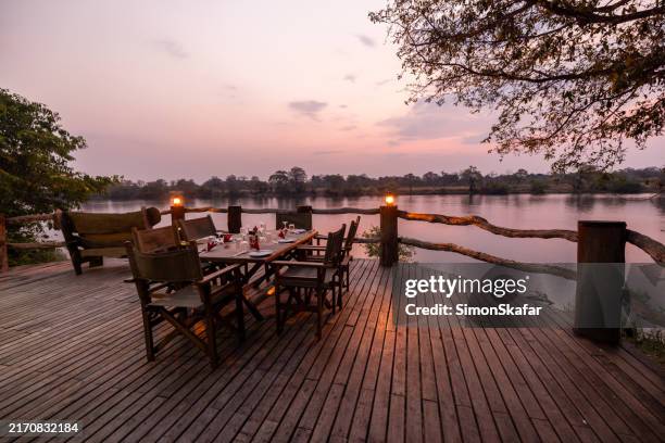 serenity at dusk by kafue river - zambia stockfoto's en -beelden