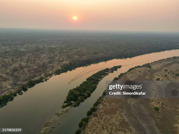 serene kafue river boat cruise at sunset - zambia stockfoto's en -beelden