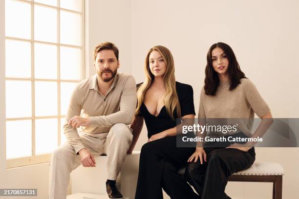 Daniel Brühl, Sydney Sweeney and Ana de Armas of 'Eden' pose in the Getty Images Portrait Studio Presented by IMDb and IMDbPro during the Toronto...