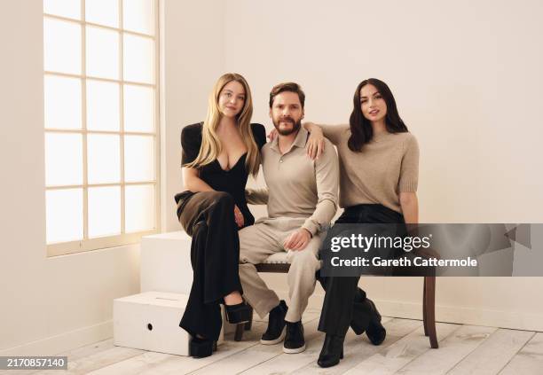 Sydney Sweeney, Daniel Brühl and Ana de Armas of 'Eden' pose in the Getty Images Portrait Studio Presented by IMDb and IMDbPro during the Toronto...