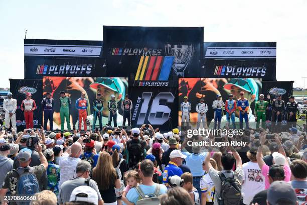 The 2024 NASCAR Round of 16 Playoffs driver poses for photos onstage during driver intros prior to the NASCAR Cup Series Quaker State 400 Available...